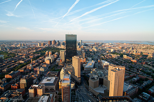 View of downtown Boston from the Prudential Tower. The John Hancock tower dominates the view in the center.
